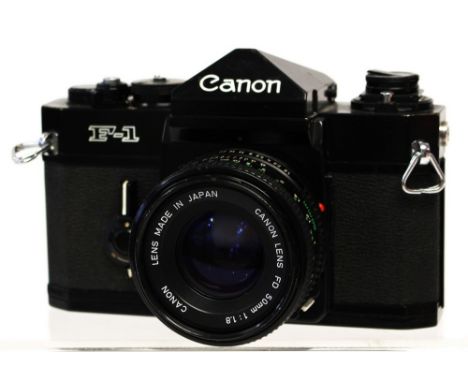 Canon: A Canon Single Lens Reflex (SLR) camera, model 'F-1', black, serial number 116474, general wear to camera, shutter wor