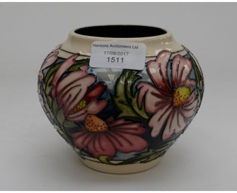 A Moorcroft 1st quality vase in the Phoebe Summer pattern, in an unusual colourway, blush daises on blue ground, designed by 
