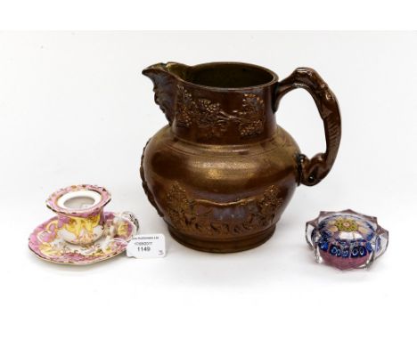 A 19th Century salt glazed Stoneware jug, relief moulded vine and cows with Royal Coat of Arms and Greyhound handle; together