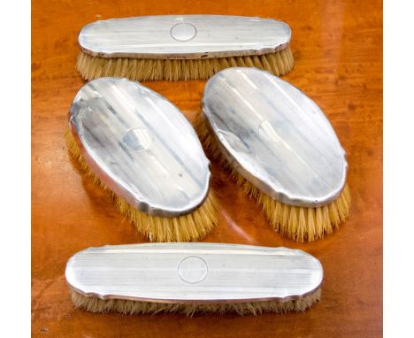 An Art Deco silver backed brush set, engine turned design, Birmingham 1926 (4) 