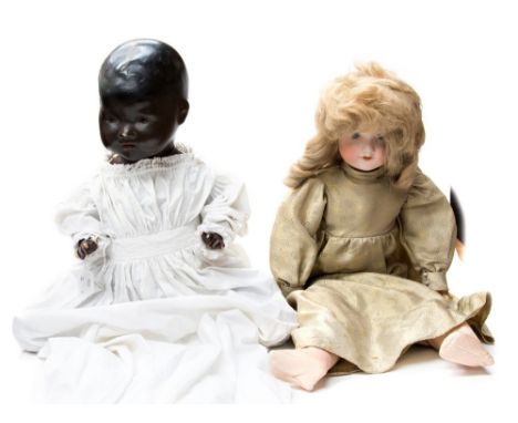 Armand Marseille: An Armand Marseille bisque head doll, open mouth, revealing four top teeth, blue eyes, composition body, st