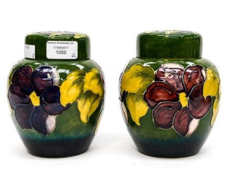 Two Moorcroft ginger jars, 'clematis' pattern on green ground, both being initialed WM to base, as well as usual stamp