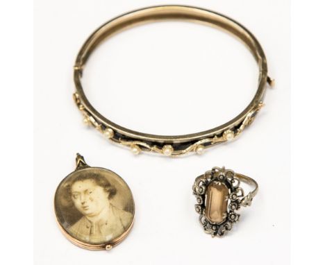 A Regency oval portrait miniature pendant of a gentleman, a black enamel and seed pearl hinged bangle and a costume ring (3) 