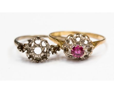 Two cluster rings, comprising of one platinum cluster without stones and one 18ct gold cluster set with a red stone possibly 