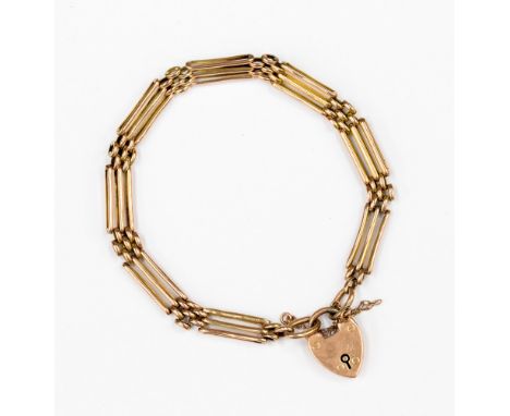 A 9ct rose gold three row gate bracelet with locket clasp and safety chain, with a weight of approx 11.8gms