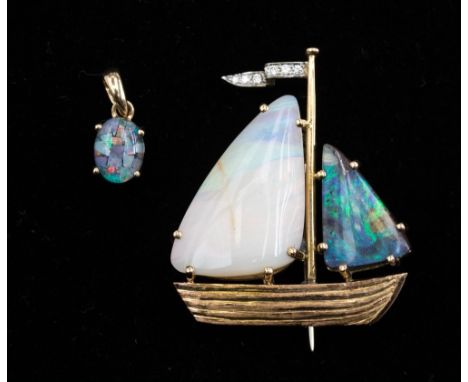 A yellow metal opal and diamond brooch in the form of a yacht, the sails are set with a black opal and a milk opal, and a fla