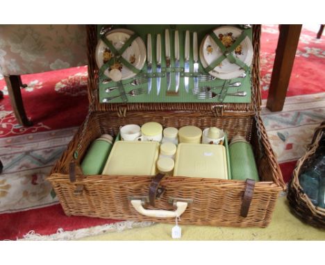 A Brexton vintage picnic hamper/set, including six ceramic cups, saucers and sandwich plates, white ground with yellow flower
