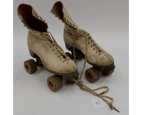 A pair of vintage Roller skates (leather) white boots with utility mark 1941, size 9 1/2