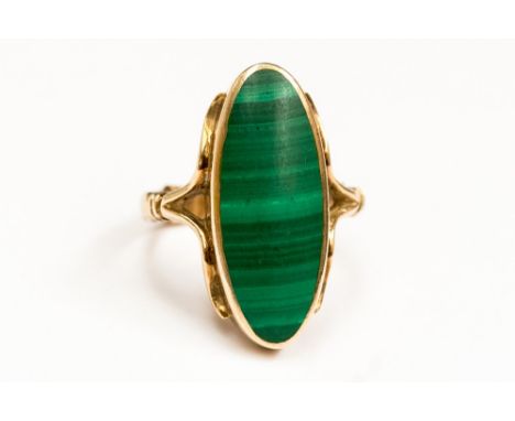 A malachite single stone and 9ct gold dress ring, stone size approx 25mm x 9mm oval, size M, with a total gross weight approx