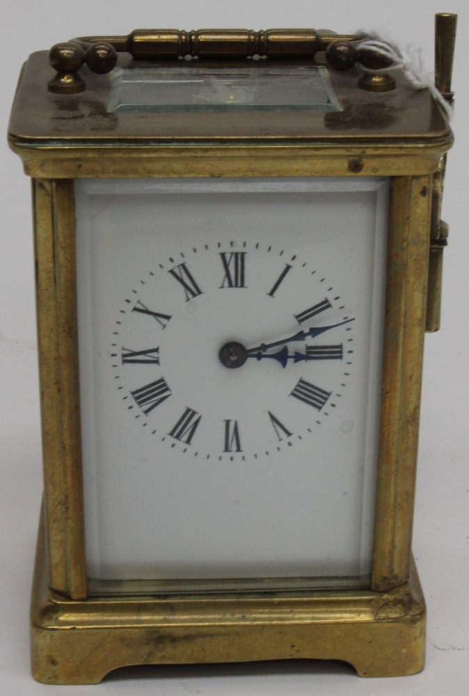 Brass carriage clock, white enamel face, Roman numerals