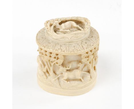 An ivory carved tea caddy, depicting an Elephant, Lion, Stag, Wolf, etc, circa 1900 