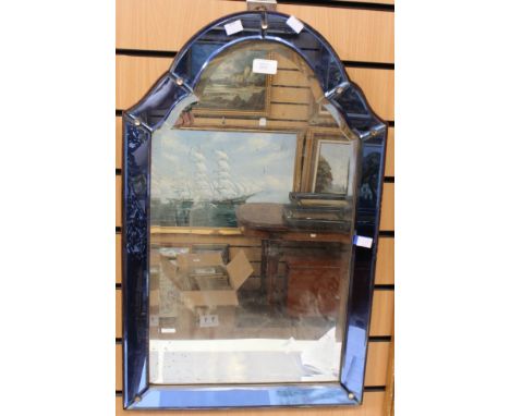 An Art Deco wall mirror with coloured glass ogee arched frame, 70 cm by 44 cm approx 