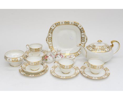 An Ansley part tea service, comprising teapot, four cups, two saucers, four plates and a sugar bowl 'Belmont' pattern, togeth