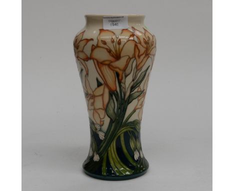 A Moorcroft vase in the Lily pattern, 1st quality, orange lillies on cream ground, standing approx 27 cm high, dated to the b