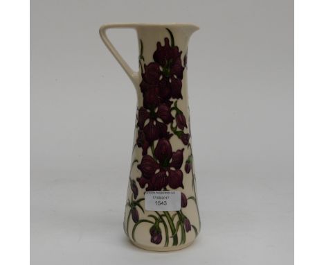 A Moorcroft pitcher in the Delphinium pattern, 1st quality in unusual colourway, purple flowers on cream ground, designed by 