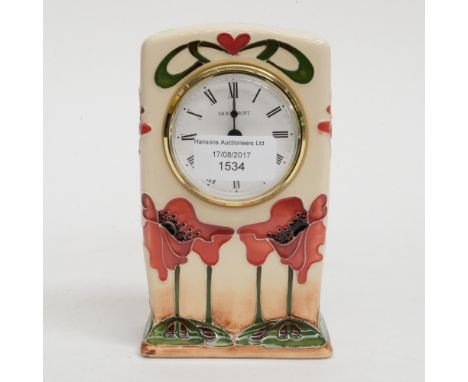 A Moorcroft clock in the 'Blue Heaven' pattern in an unusual colourway, 1st quality, designed by Nicola Slaney, dated to the 