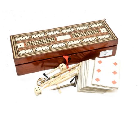 A Victorian Tunbridge ware games box with cribbage board lid and a full set of cards within, silk lined 