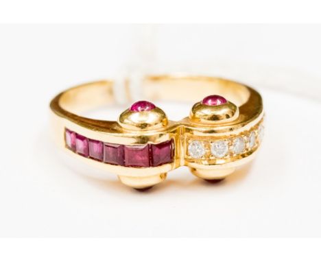 A diamond and ruby double scroll ring in 18ct  yellow gold, one side set with square rubies the other with round brilliant cu