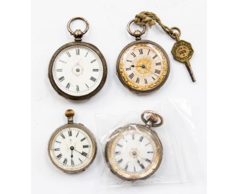 A group of four silver ladies pocket watches, half hunters, white enamel dials, some with gold details and foliate designs a/