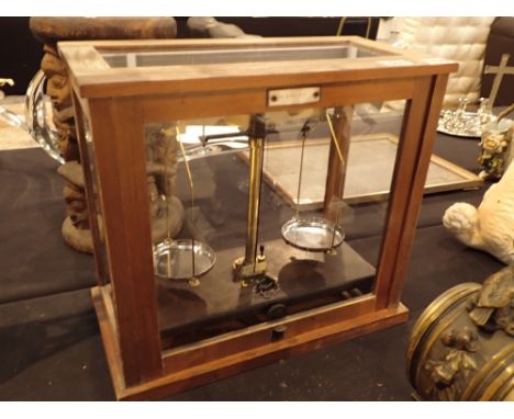 Glass cased set of scientific scales