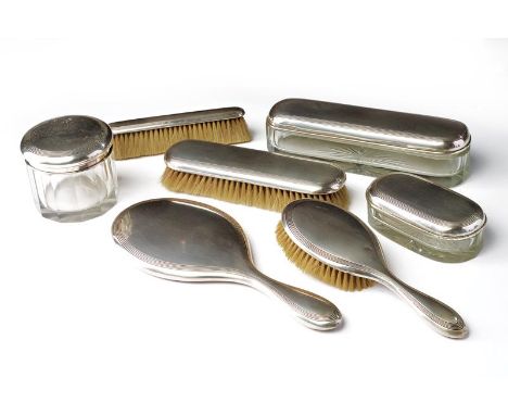 A 7 pieces silver and glass toilet service. Italy, first half of the 20th Century. Minors defects. 