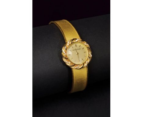 Jaeger- Lecoultre vintage ladies wrist watch. Two tones 18 kt gold case and bracelet, two tone 18 kt gold watch bezel set wit