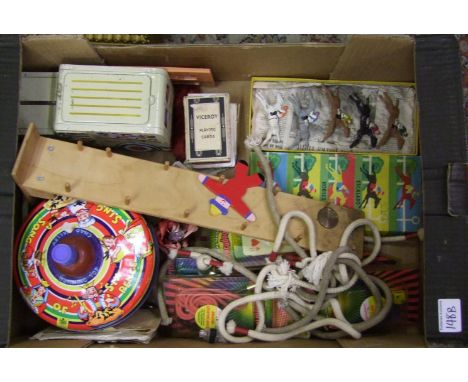 A mixed collection of vintage toys: to include a spinning top, set of Escalado horses, magic tricks etc. 