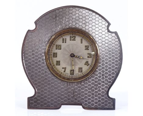 A Swiss unmarked silver-framed travelling clock, circa 1920, with engine turned front, height 10cm