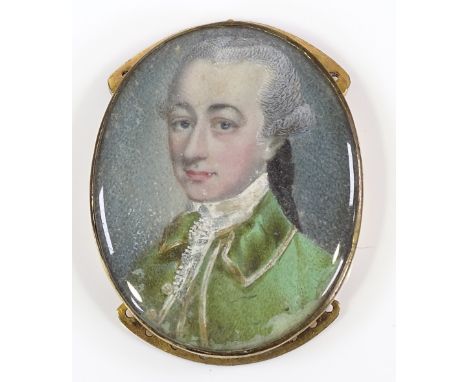 A Georgian miniature portrait bracelet snap, depicting a gentleman in a green velvet coat, in unmarked yellow metal frame, le