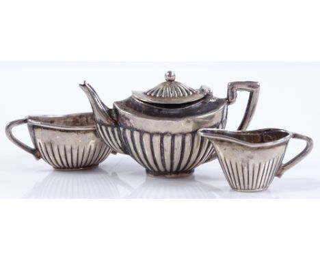 A miniature 3-piece silver tea set, of Queen Anne style, by Levi &amp; Salaman, hallmarks Birmingham 1913, teapot height 2.8c