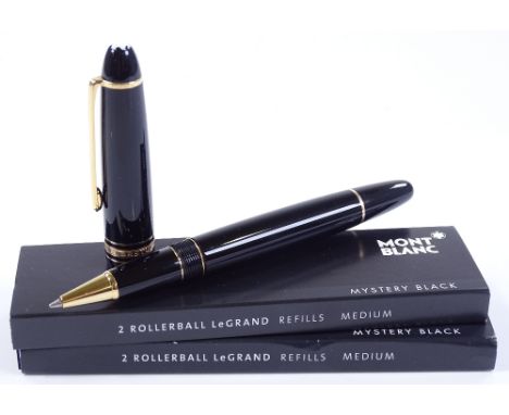 A Mont Blanc Le Grande rollerball pen, in black resin with gold plated fittings and 3 spare refills, model no. 11402