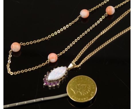 A 9ct gold opal and ruby pendant, a 9ct gold coral necklace and a gold coin stickpin (3)