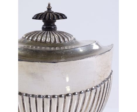 A late Victorian oval silver tea caddy of half fluted form, by James Deakin &amp; Sons, hallmarks Sheffield 1896, height 12cm