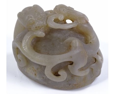 A Chinese carved and pierced jade dragon ornament, length 6cm