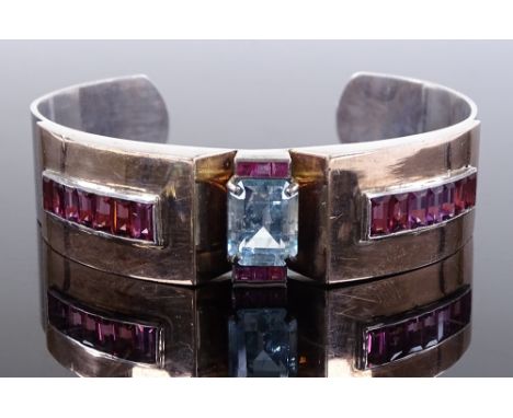 A 1940s aquamarine ruby and pink tourmaline set bangle, silver settings topped with gold, bangle width 17mm, internal diamete