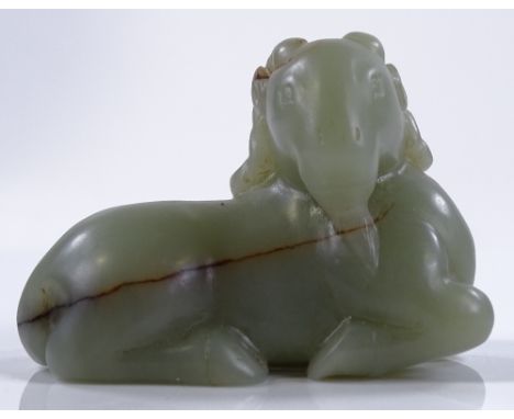 A Chinese green jade carving of a reclining goat, length 7cm