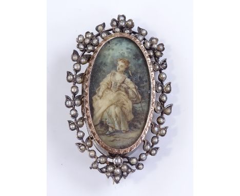 An ivory portrait miniature brooch, depicting a seated Classical lady, in silver-gilt frame set with seed pearls, height 5.96