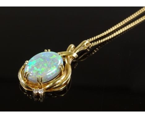 An 18ct gold black opal and diamond stylised pendant on chain, cabochon black opal approx 15mm x 11mm x 6.5mm, chain length 4