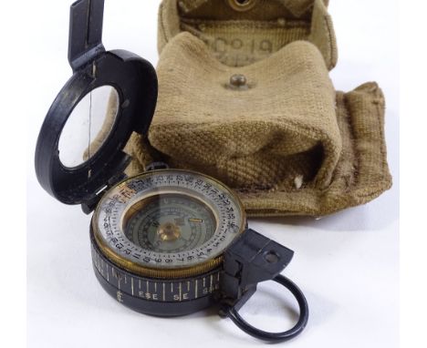 A Second War Period Military Mark III compass, dated 1940, serial no. 61825, maker's marks TG Co Ltd London, original canvas 