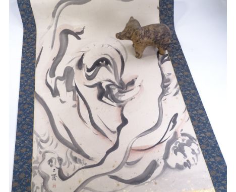 An Antique Chinese ceramic elephant, length 22cm, and a Japanese scroll depicting an elephant (2)