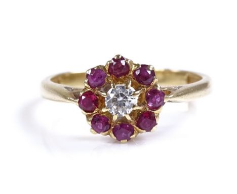 An 18ct gold ruby and diamond cluster flowerhead ring, setting height 9.1mm, size N, 2.9g