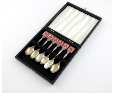 A set of six silver and enamel teaspoons, by Turner and Simpson, Birmingham 1930, the rectangular terminals enamelled with a 