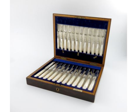 A set of twelve silver fruit knives and forks, by W and R Sorley, London 1916, plain blades, tapering mother-of-pearl handles