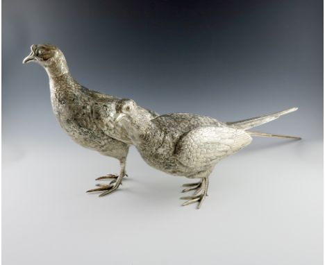 A large pair of modern silver life size pheasants, by James R. Biggins, Sheffield 2013, modelled in standing positions, heigh