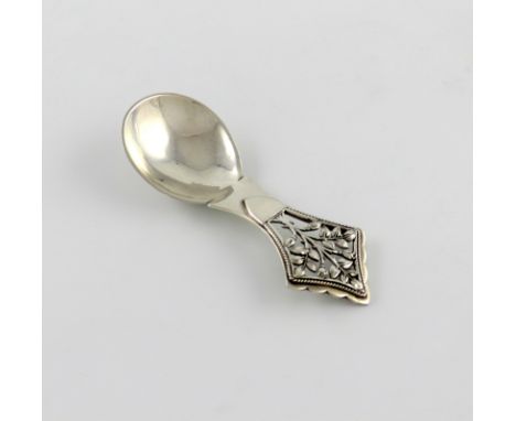 By H. G. Murphy, an Arts and Crafts silver Tree of Life caddy spoon, London 1929, also marked with the Falcon mark, spot-hamm