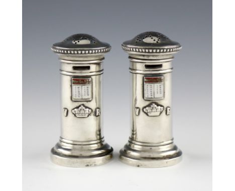 A pair of Victorian novelty silver and enamel pepper pots, by Hilliard and Thomason, Birmingham 1894, modelled as cylindrical