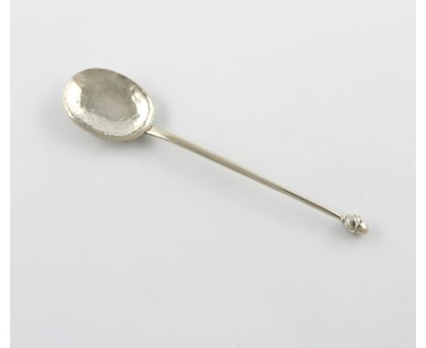 By Winifred King and Co, an Arts and Crafts silver Acorn knop spoon, Birmingham 1928, spot-hammered oval bowl, the tapering s