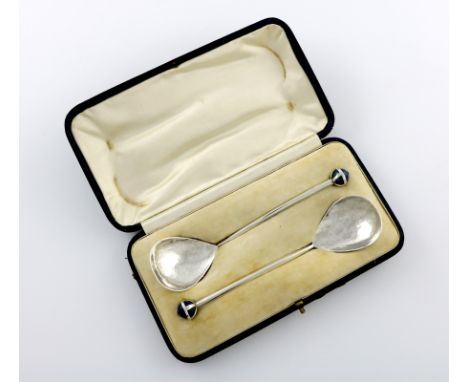 By Robert Cadelent, a pair of Arts and Crafts silver spoons, London 1913, fig-shaped bowls, spot hammered decoration, taperin