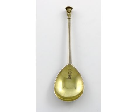 An Elizabeth I silver Seal-top spoon, maker's mark of a mullet over an annulet, London 1597, the fig shaped bowl later gilded