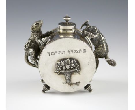 A continental metalware inkwell, bearing pseudo early 19th century Russian hallmarks, cylindrical form, mounted with two rats